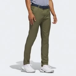 Adidas Golf Trousers - Primegreen Tapered Pant - Olive Strata AW23 16 Adidas Golf Trousers - Primegreen Tapered Pant - Olive Strata AW23 -Fashion Golf 0004 hr9048 5 apparel on model walking view grey